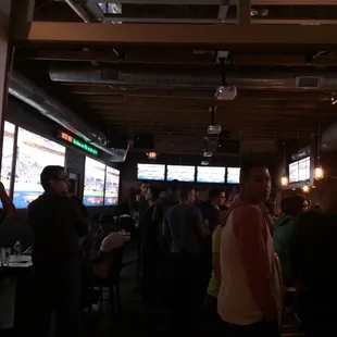a large group of people in a bar