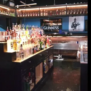 a bar filled with bottles of alcohol