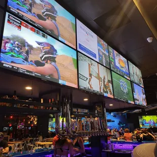 multiple televisions and a bar