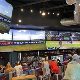 Giant Horse shoe bar, with TONS of TVs.  Perfect for UFC &amp; Sports Games.