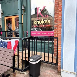 a bench in front of a store