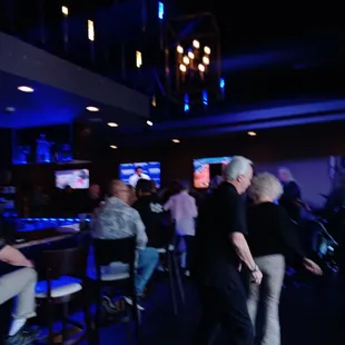 a group of people at a bar