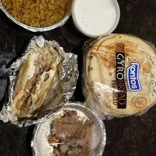 Chicken shawarma (no lettuce or tomato), side of rice, pack of pitas, large side of tzatziki, several pieces chicken souvlaki