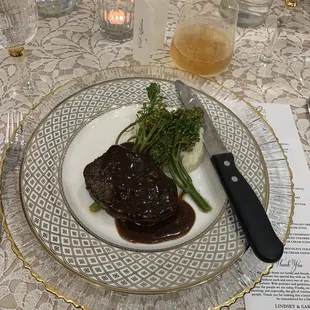 Steak, mashed potatoes, greens.