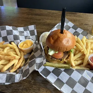 Fries with nacho cheese on side. Cheeseburger