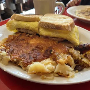 Breakfast club special &amp; side homefries  Egg, bacon, cheese, homefries on scali