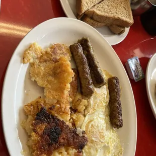 2 eggs over easy with sausage &amp; wheat toast and homefries