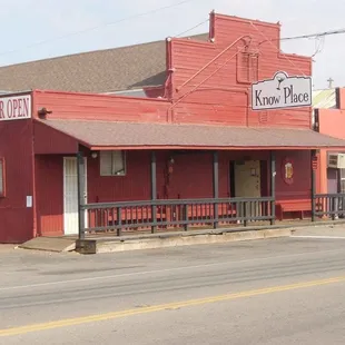 a red building on a street corner