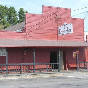 a red building with a street sign