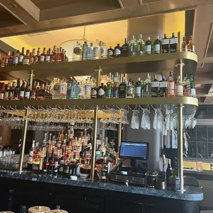 a bar with a variety of liquors