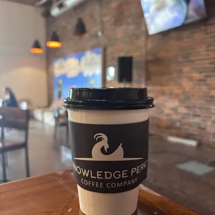 Remote working from an 8 person community table with plenty of outlets.