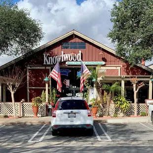 a car parked in front of the restaurant
