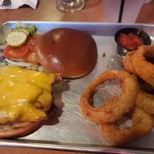 Reg burger $11.99, add cheese $.99, add bacon $1.99, add rings $3.99