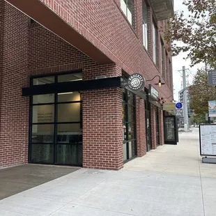 a brick building with a clock