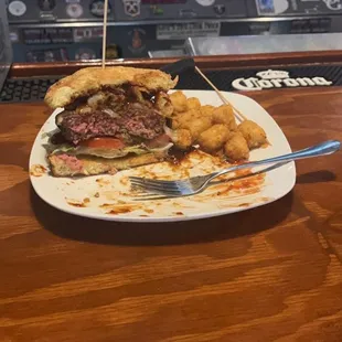 a steak sandwich and onion rings