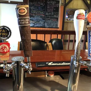 a row of beer taps