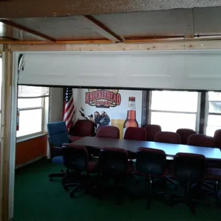 The meeting room can comfortably hold 12-15 people. You can close the garage door for privacy.