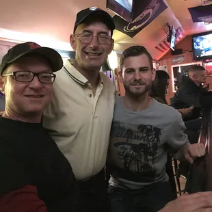 three men posing for a picture