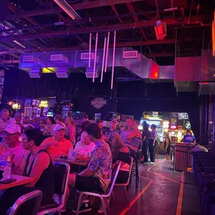 a crowd of people sitting at tables