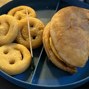 Children&apos;s cheeseburger and smiley fries