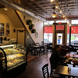 The coffeehouse side of the restaurant has plenty of seating and a restored tin ceiling.