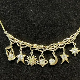 Custom pendant made by Knutson jewelers under store lighting.