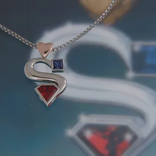 Superman pendant from her Superman.