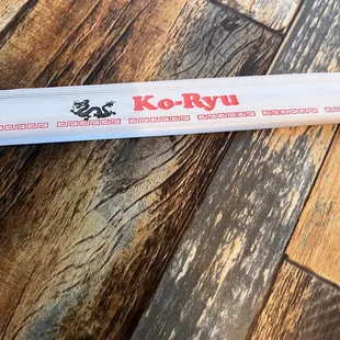 a baseball bat laying on a wood floor