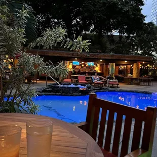 an outdoor pool and patio area