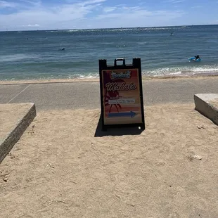 a sign on the beach