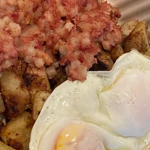 Corned beef hash, eggs &amp; home cooked potatoes.