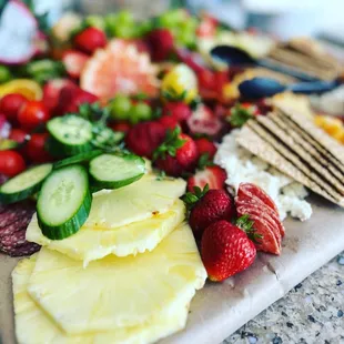 a platter of fruit and cheese