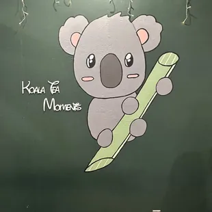 a koala on a surfboard