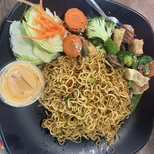 Ramen with tofu and veggies. Mom is vegetarian and liked it but asked to leave the spice out.