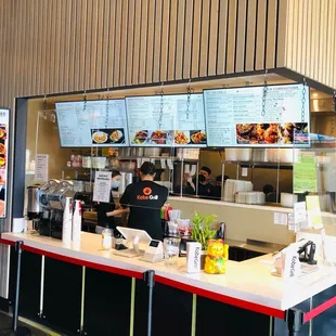 the counter and menus of the restaurant