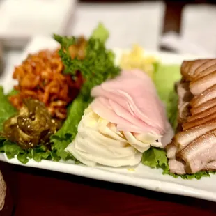 Around since 1983! Best Korean Bossam (boiled pork belly) dish ever had! Layer like an open sandwich, food &amp; eat