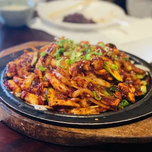 Stirfried Calamari  Spicy stir-fried calamari with assorted vegetables and rice cake ($20.99)