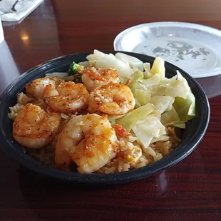 a bowl of shrimp and noodles