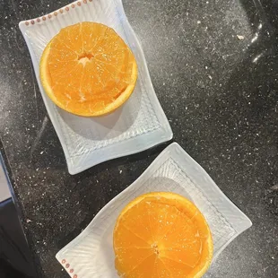 Volcano roll and complementary orange slices