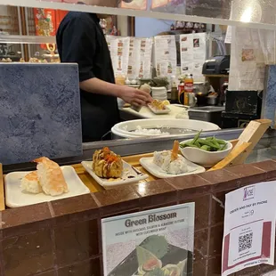 Get a spot by the sushi master so you can watch all the action