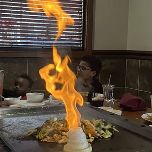 a flame coming out of the grill