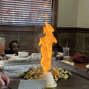 a flame coming out of the grill