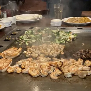 Shrimp, chicken, salmon and steak with fried rice and noodles!