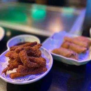 a plate of deep fried chicken strips