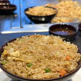 a bowl of fried rice on a table