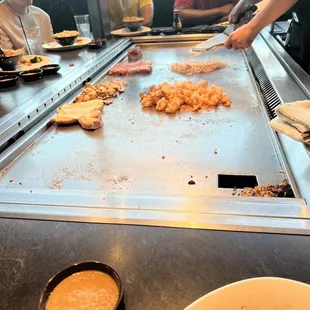 a group of people in a restaurant preparing food
