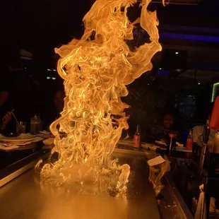 a large flame coming out of the grill