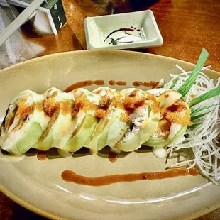 Hole-in-One Roll (cucumber outside/crab salad middle/maguro,sake,hamachi inside/spicy garlic mayo sauces)