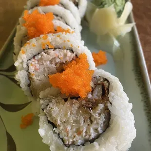 a plate of sushi rolls on a table
