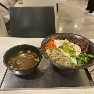 a bowl of soup and a bowl of noodles